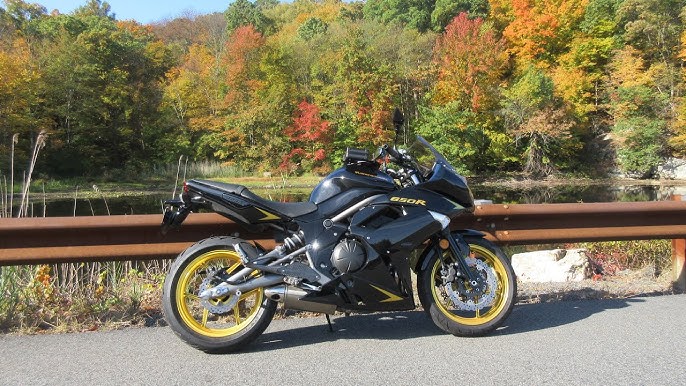 Riding a Black and Gold Kawasaki Ninja: Ultimate Style & Speed.
