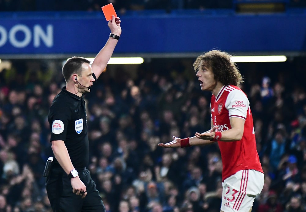 Why is a red card in soccer shown? A simple guide to the serious fouls involved.