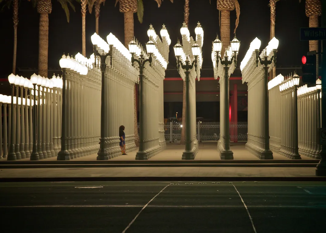 What do images of los angeles at night show? Experience the dazzling lights and famous spots.